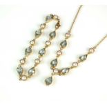 A 9ct gold aquamarine and cultured pearl necklace and bracelet suite