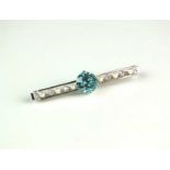 A blue zircon, diamond and seed pearl bar brooch