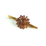 A ruby set stylised star burst bar brooch