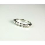 A Tiffany & Co platinum seven stone diamond ring