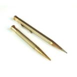 Two 9ct gold retractable pencils