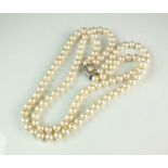A two strand uniform cultured pearl necklace with diamond clasp