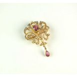 An early 20th century pink tourmaline and seed pearl pendant/brooch