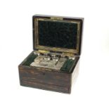 A Victorian Coromandel cased silver mounted travelling dressing table box