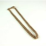 A 9ct rose gold graduated curb link albert