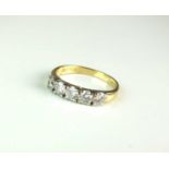 An 18ct gold five stone diamond ring