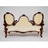 A Victorian walnut, three-seater settee