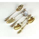 A pair of Victorian silver gilt figural spoons, two silver tablespoons and a sugar sifter spoon