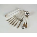 A set of six silver lobster picks, two silver sauce ladles and a pair of silver sugar tongs