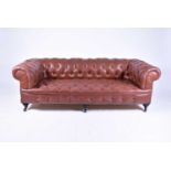 A late Victorian hide covered, buttoned Chesterfield
