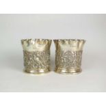 A pair of Victorian silver coasters by William Comyns