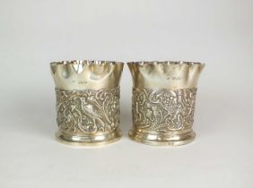 A pair of Victorian silver coasters by William Comyns