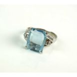 An aquamarine and diamond ring