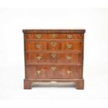 An 18th century and later walnut veneered bachelors chest