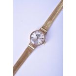 Omega: A lady's 9ct gold bracelet watch with 18ct bracelet and further 9ct bracelet