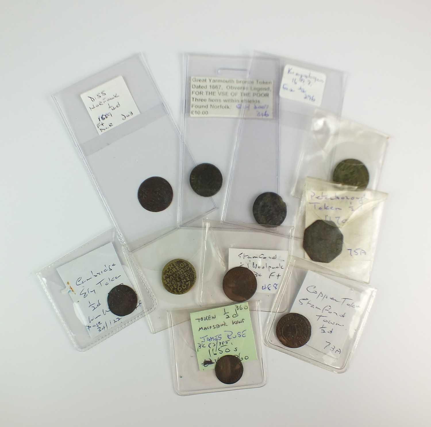 A collection of 17th century copper tradesmans tokens