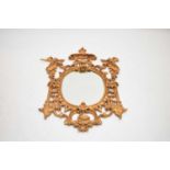 A reproduction rococo style giltwood wall mirror