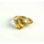 An 18ct gold citrine and diamond ring