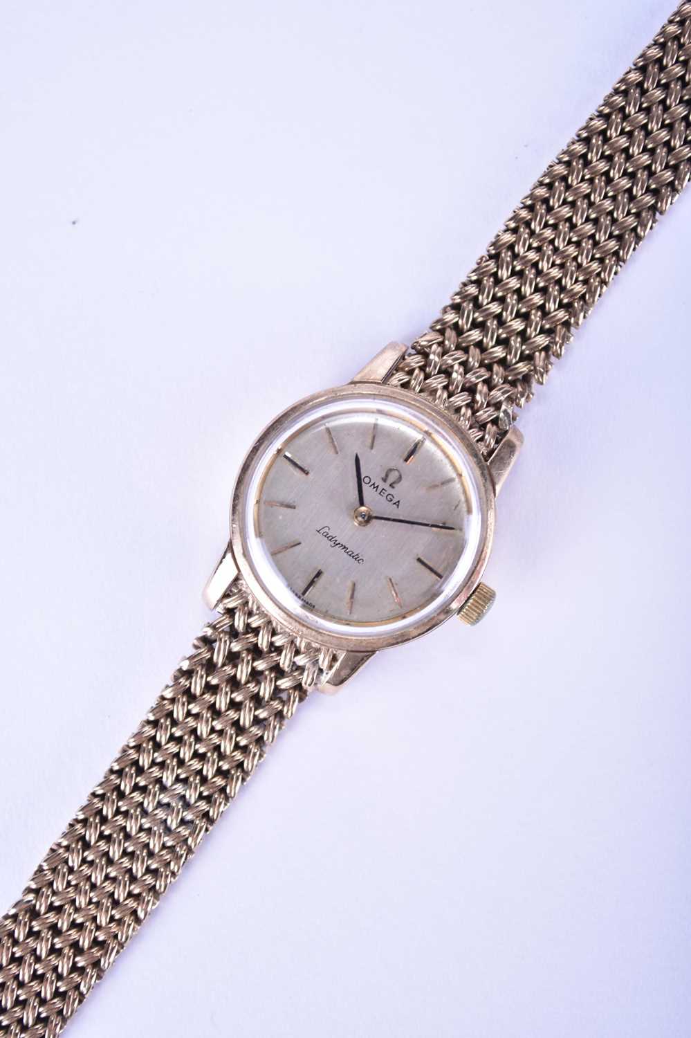 Omega: A 9ct gold Ladymatic bracelet watch