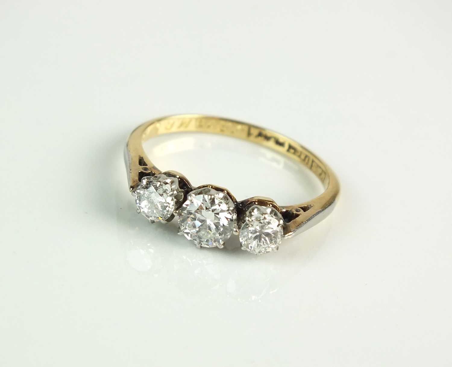 A graduated three stone diamond ring