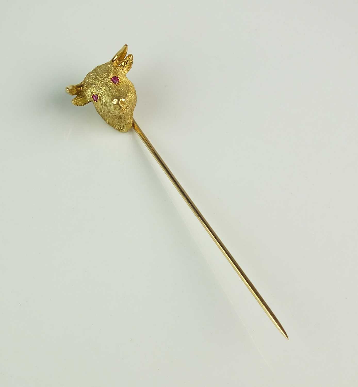 A yellow metal Bull's head stick pin