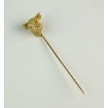 A yellow metal Bull's head stick pin