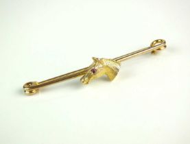 A yellow metal horse head bar brooch/stock pin,