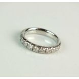 A platinum diamond half hoop eternity ring