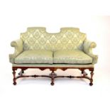 A 20th century, William and Mary style walnut sofa