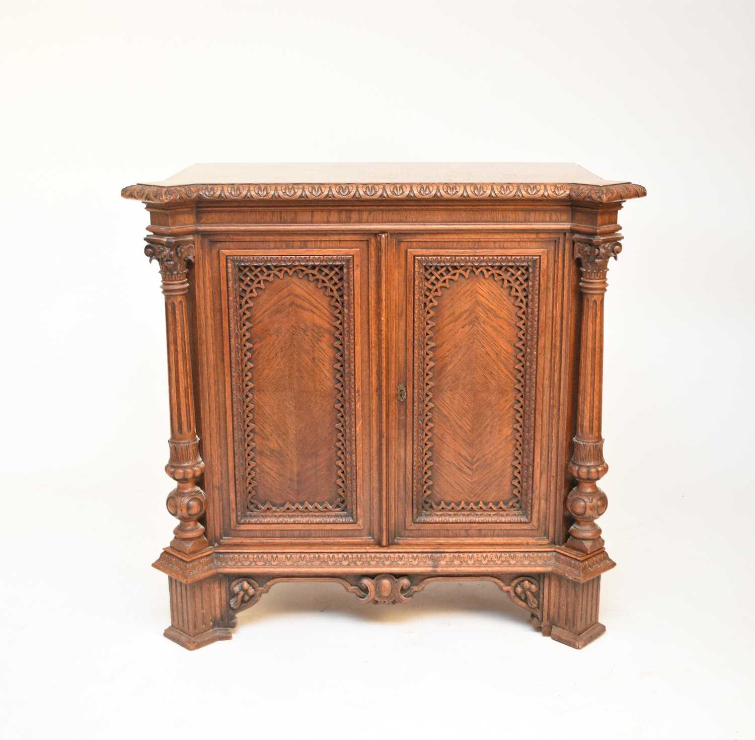 A good 19th century parquetry and carved oak cabinet, probably French