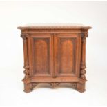 A good 19th century parquetry and carved oak cabinet, probably French