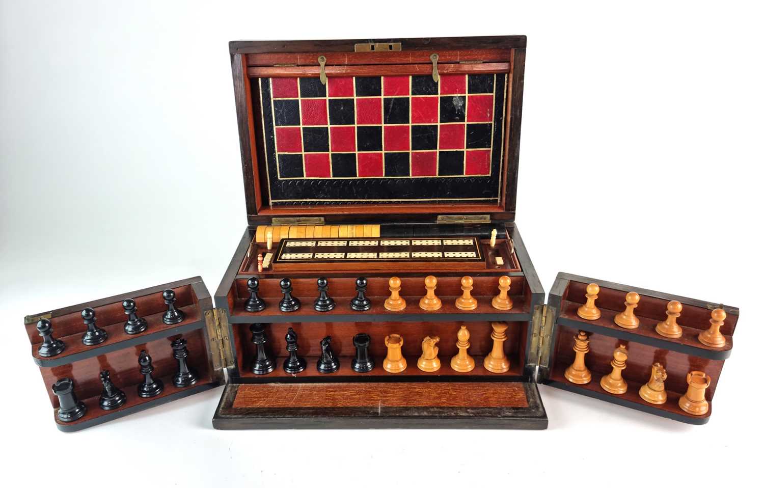 A Victorian walnut and rosewood games compendium