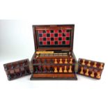 A Victorian walnut and rosewood games compendium