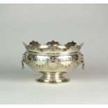 An Edwardian silver rose bowl of monteith form