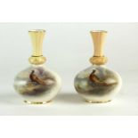 A near pair of Royal Worcester vases painted by James Stinton with pheasants
