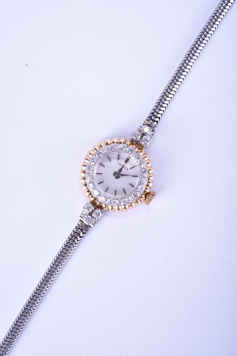 Vertex: A lady's diamond-set bi-metal watch on a 9ct white gold bracelet