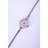 Vertex: A lady's diamond-set bi-metal watch on a 9ct white gold bracelet
