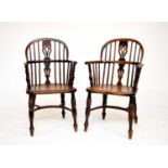 A pair of early-mid 19th century yew and elm low-back, double hoop Windsor elbow chairs