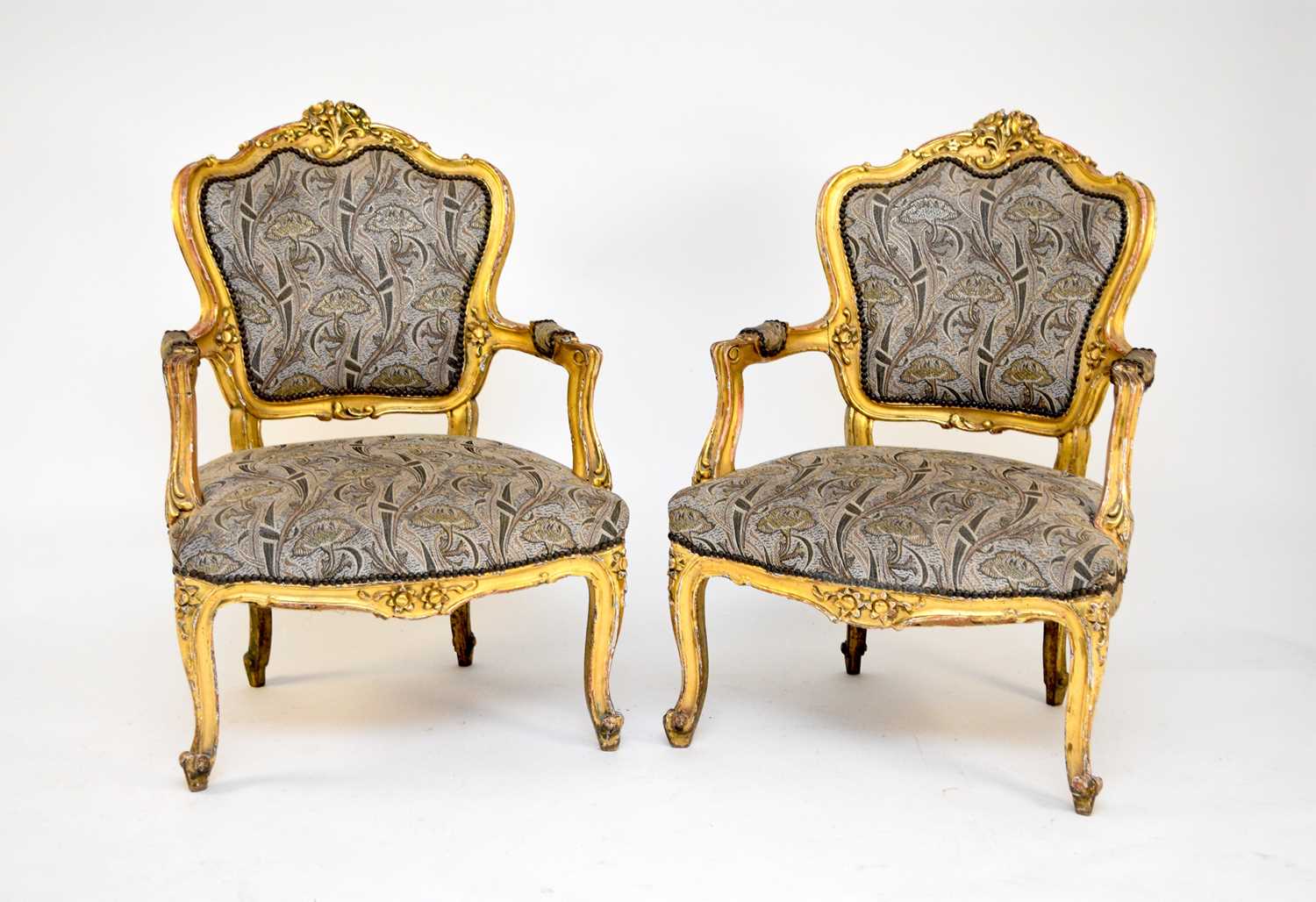 A set of 4 Continental, Louis XV style gilded armchairs