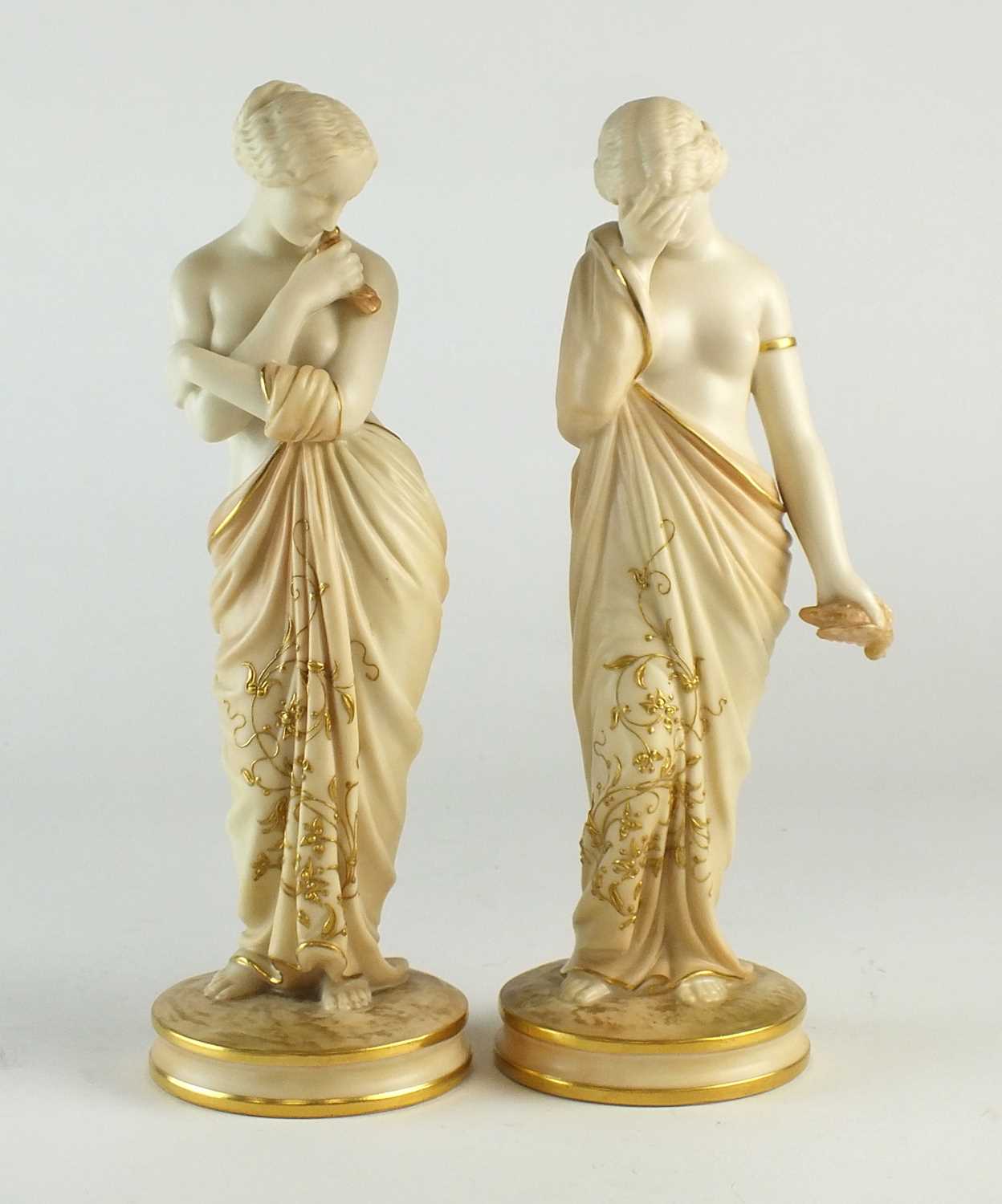 A pair of Royal Worcester figures of Joy and Sorrow