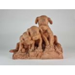 French terracotta group of three pug dog puppies looking at lizard, after Georges Lucien Vacossin