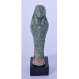 A small Egyptian carved stone statue on a stand 9cm.