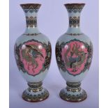 A PAIR OF 19TH CENTURY JAPANESE MEIJI PERIOD CLOISONNÉ ENAMEL VASES decorated with dragons upon a bl
