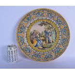 AN 18TH/19TH CENTURY ITALIAN FAIENCE TIN GLAZED POTTERY DISH painted with figures. 35 cm diameter.