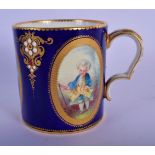 19TH C. SEVRES STYLE MUG PAINTED WITH CHILDREN IN THE OVAL PANELS ON A COBALT BLUE GROUND . 7.5cm h