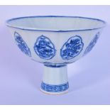 A Chinese porcelain blue and white stem cup decorated with dragons in panels. 12 x 17cm.