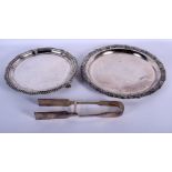 TWO SILVER PLATED DISHES and a pair of tongs. 1810 grams. Largest 30 cm wide. (3)