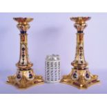 A PAIR OF ROYAL CROWN DERBY IMARI PORCELAIN CANDLESTICKS painted with flowers and vines. 28 cm high.