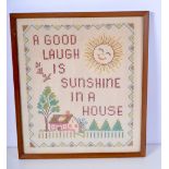 A framed antique sampler 36 x 31cm .