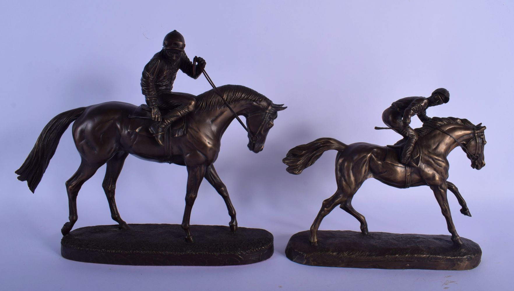 TWO BRONZED EQUESTRIAN SCULPTURES OF RACE HORSES. 30 cm x 28 cm. (2)